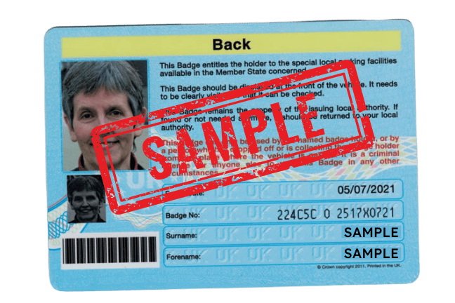 Example photo of the reverse side of a Blue Badge, showing the photograph, name and expiry date, with the whole badge in frame.